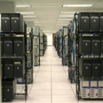 file server aisle showing the servers in various rows of racks
